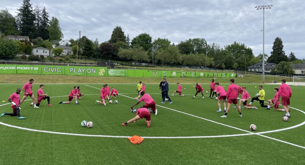 Team stretching during training